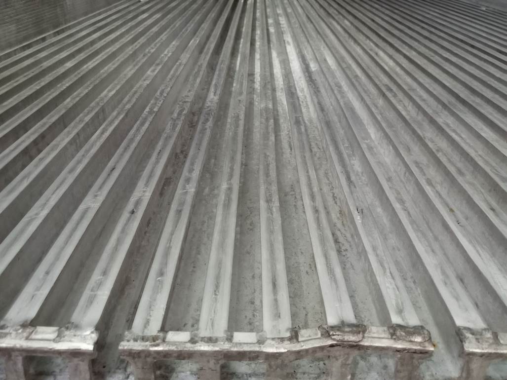 Imagen que contiene exterior, edificio, sol, hecho de madera
Descripción generada automáticamente